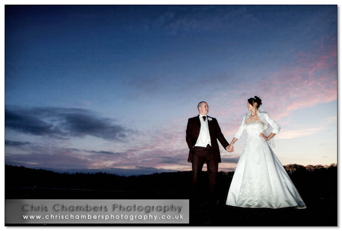 The bride and groom at sunset at Walton Hall Wakefield