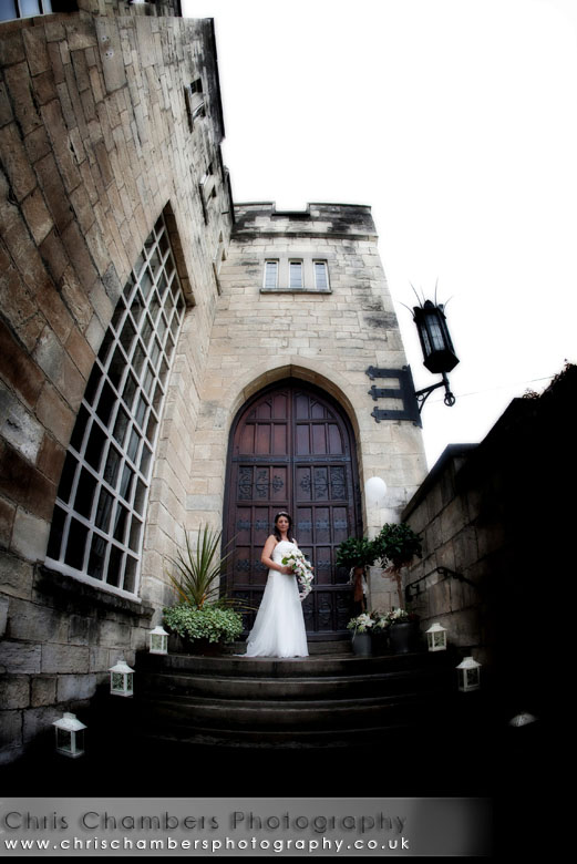 Hazlewood Castle wedding - the bride on the steps at Hazlewood Castle