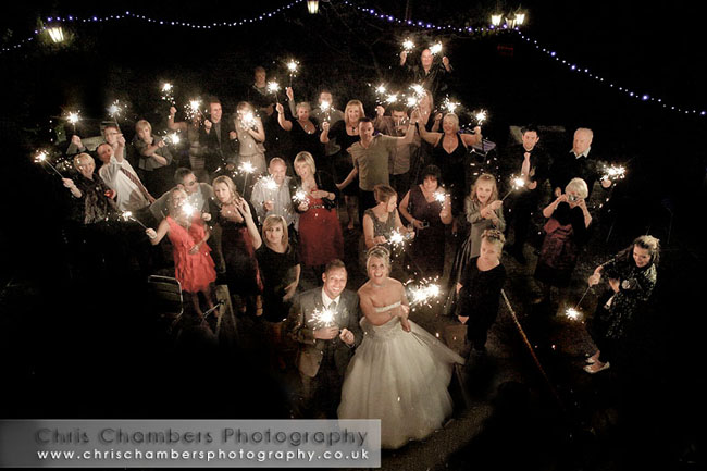 Wedding guests hold their sparklers high just after midnight. Happy New Year